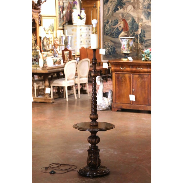This handsome antique floor lamp combines sculptural Louis XIII styling with the practical addition of an integrated side...
