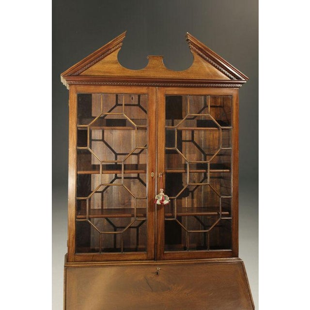 Exceptional 18th-century English George III drop-front secretary with bookcase, crafted in mahogany and dating to circa...