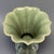 Fine antique Chinese celadon gu‑form vase. Flaring foliate rim, lobed body with carved relief floral ornament, elegant...