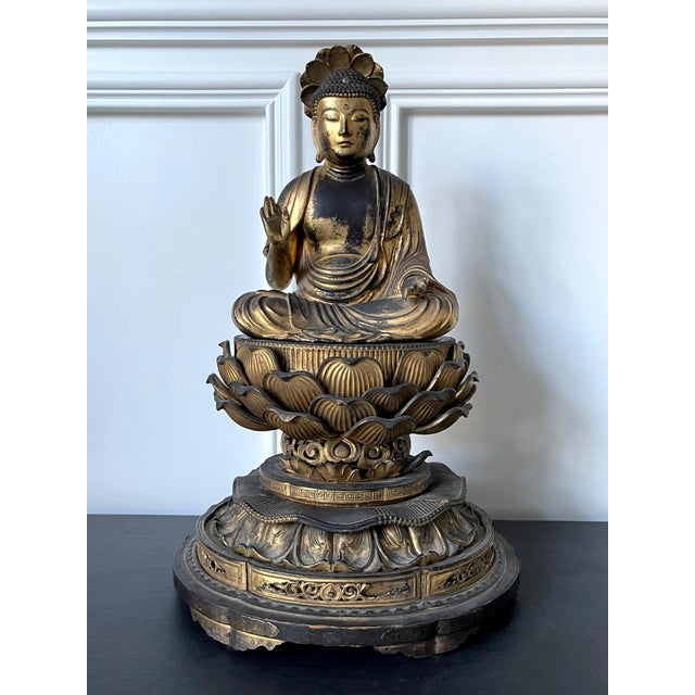 A Japanese carved wood Amitabha (Amida) Buddha statue with residual gold leafed surface circa 19th century (late Edo...