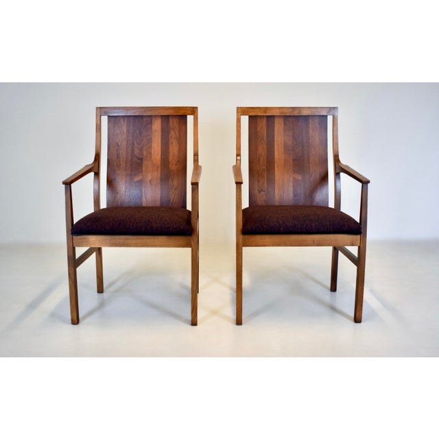 A striking pair of Mid 20th century Walnut armchairs by Lane furniture. The new upholstery beautifully compliments the...