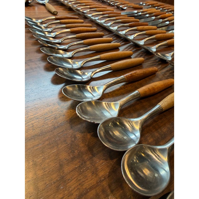 Dansk Wood Accent Flatware – Jens Quistgaard De, 1970s – Teak & Stainless (52-Piece Set) Beautiful mid-century Dansk...