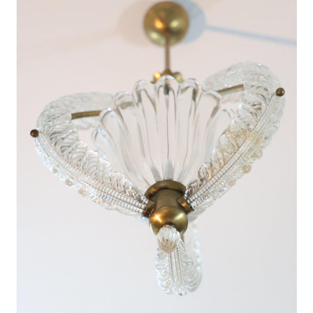 A stunning Murano glass chandelier with a brass frame by Barovier e Toso. Period of production: 1940–1950 The chandelier...