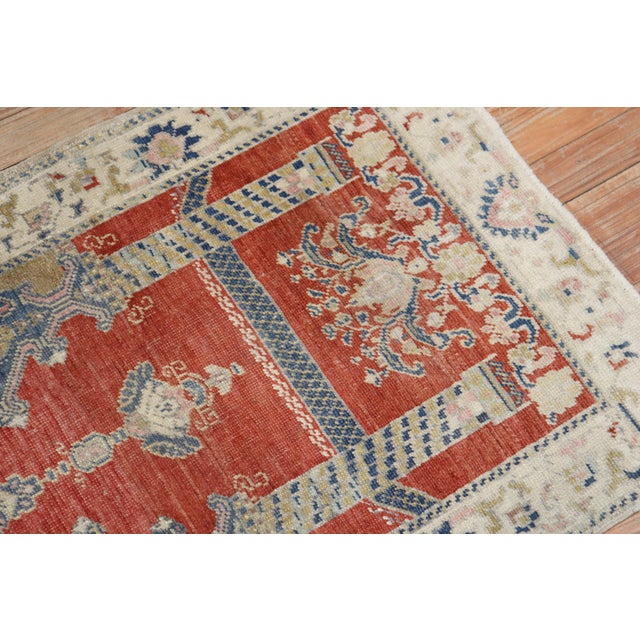 An early 20th century wool Turkish Sivas mat square size rug with a double scroll column prayer motif on a brick color...