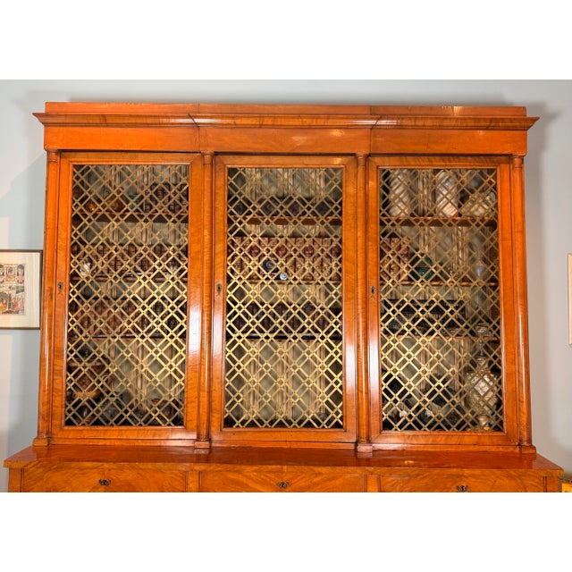 An impressive Austrian Biedermeier bookcase, circa 1840, finely constructed in richly figured maple with an architectural...