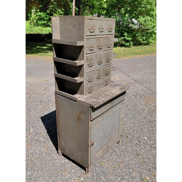 Vintage shop made Machinists cabinet. It is 56" high x 19" deep x 25" wide. Good condition with some losses to wood and...