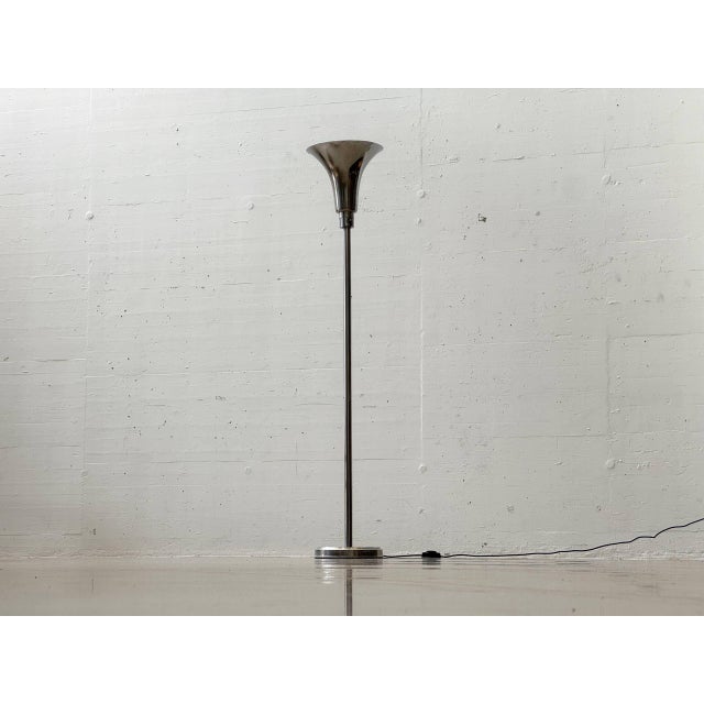 Elegant Art Deco floor lamp with classic, timeless lines and a characteristic trumpet shade. The lamp captivates with its...