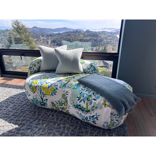 Rounded plush tight seat and a curvy arm chaise upholstered in Schumacher's "Citrus Garden" (indoor/outdoor) in Pool. This...