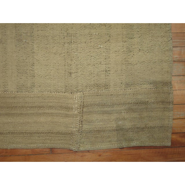 A mid-century Turkish Kilim with a modern twist. Measures: 8'10'' x 8'10''.