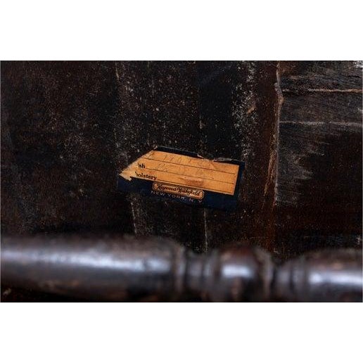 Heywood-Wakefield spindle back armchair featuring arched top rail with scrolled arm rests with unusual arched cross...