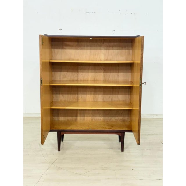For sale is a Danish teak linen cupboard from the 1960s, whose timeless, minimalist elegance and rich, warm wood tone make...