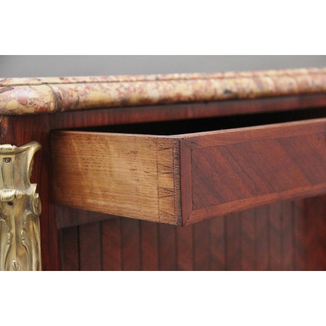 A pair of 19th Century French Kingwood and marble top commodes of exceptional quality, having the original highly...