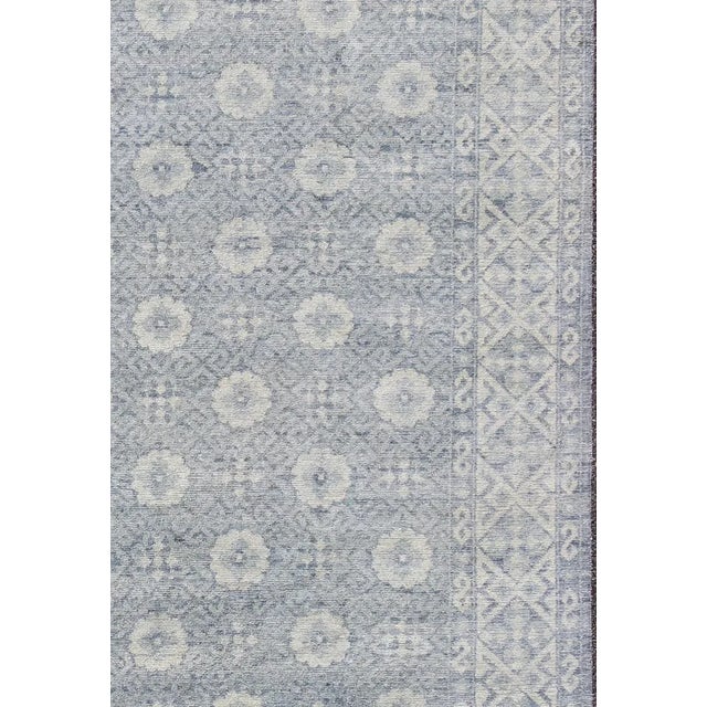 Elegant All-Over Design Khotan rug in muted shade of cream and blues, rug / country of origin / type: India / Khotan,...