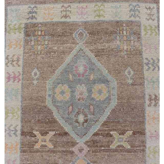 Turkish Oushak Runner With Soft Brown Field and Pale Blue Geometric Medallions For Sale - Image 4 of 12