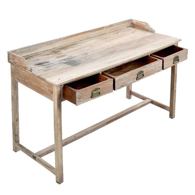 This solid wood desk is a perfect example of functional and elegant 20th century furniture. Its sleek design and natural...