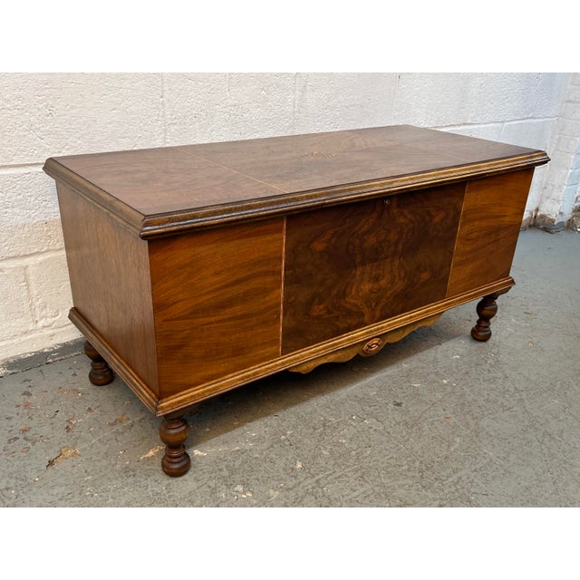 Vintage figured walnut cedar chest by Dillingham Manufacturing Company. Showcasing a beautifully bookmatched figured...