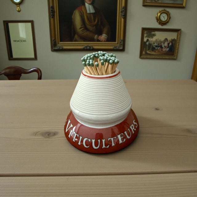 An authentic French café ceramic match striker dating to the interwar period, circa 1920s–1930s. This sculptural tabletop...