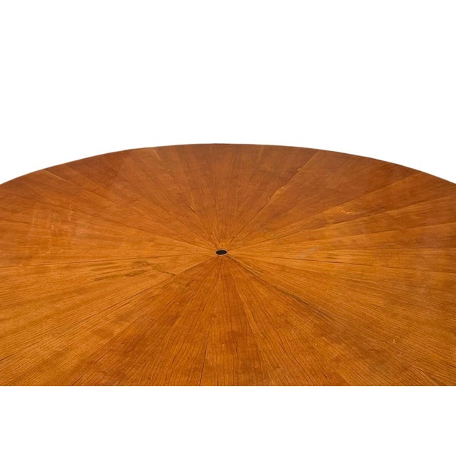 Elegant Austrian Biedermeier Revival center table, early 20th century, executed in richly figured veneer with contrasting...