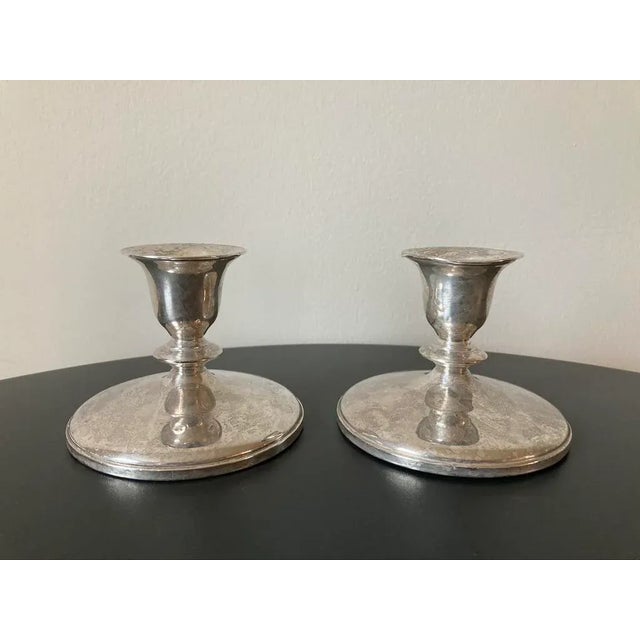 A beautiful pair of American candlesticks, circa early 20th century, USA. A shiny pair of candlesticks for traditional...