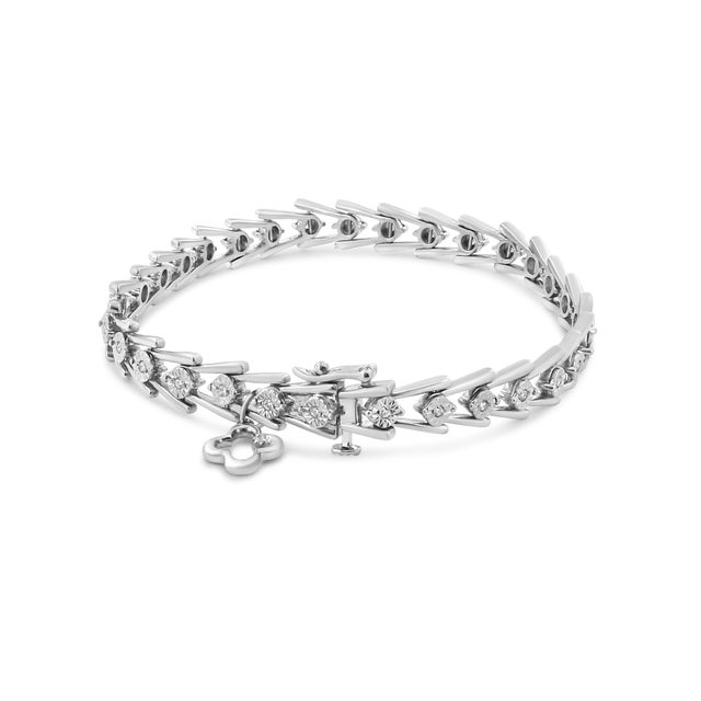 Add a little sparkle to your wrist with this lovely link bracelet. Crafted in sterling silver, this bracelet showcases...