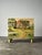 A storybook English cottage unfolds across every surface of this one-of-a-kind antique four-drawer chest, painted in soft...