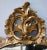 An elegantly carved French Louis XV style rococo giltwood oval mirror; surmounted by a rocaille openwork crest above an...