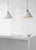 Cleo Pendant in Antique-Burnished Brass and Antique White with Frosted Acrylic Designer: Kelly Wearstler Fixture Height:...
