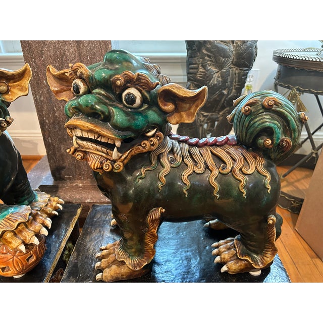 Pair of 19th Century Chinese Foo Dogs On Stands. Stunning large pair of antique Chinese beautifully hand decorated glazed...
