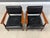 A pair of mid century modern solid walnut frame lounge chairs with black leather made by Stow Davis. Circa 1970’s. Made in...