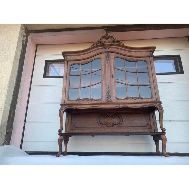 Rocaille sideboard for a living room or library from the 19th century. It is made entirely of oak wood. - Supported on...