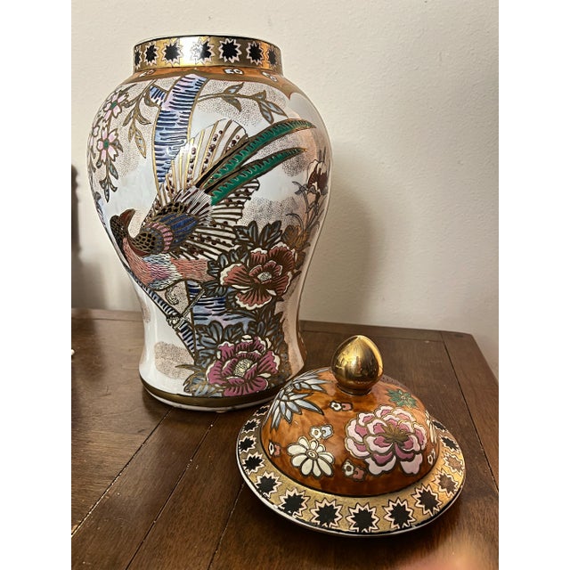 Stunning large Chinoiserie ginger jar. Gilded brass top. The oval gold foil sticker identifies it as Andrea by Sadek, a...