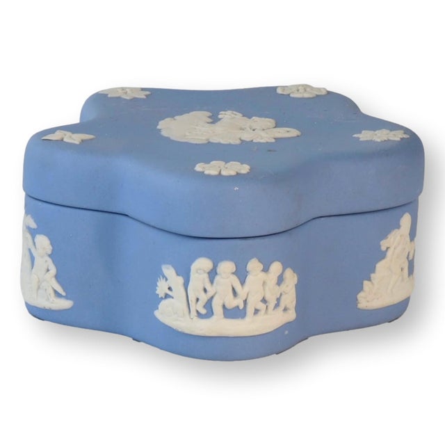 A beautifully crafted Wedgwood Jasperware trinket box in the classic blue and cream colorway. This midcentury piece...