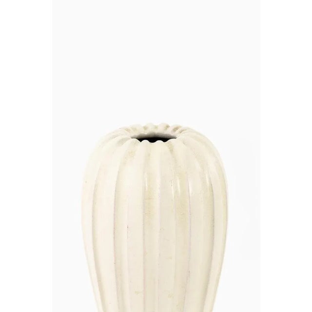 Rare Vase Designed by Vicke Lindstrand. Produced by Upsala Ekeby in Sweden. This piece is attributed to the mentioned...