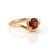 Capture dramatic romance with the intense, crimson glow of natural red garnet. The smooth, sweeping band curves under the...