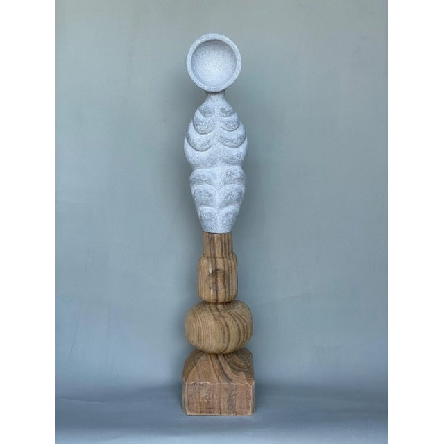 Echo on wood hand carved marble sculpture by tom von kaenel. Dimensions: d 15 x w 15 x h 76 cm. Materials: marble, wood...