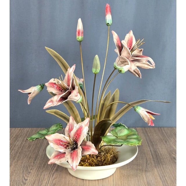 Hand made sculpture of Lily's with Brass leaves mounted in a ceramic planter. This is not signed, no sticker but...