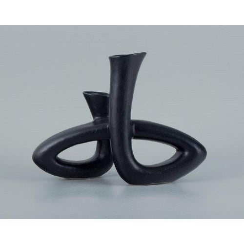 European studio ceramicist. Unique twisted vase in black glaze. Late 1900s. In perfect condition. Dimensions: length 28.0...