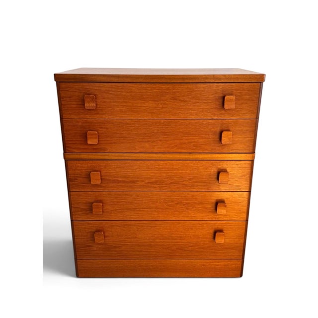 A striking vintage tallboy chest of drawers designed by Ron Carter for Stag as part of the iconic Cantata Collection,...