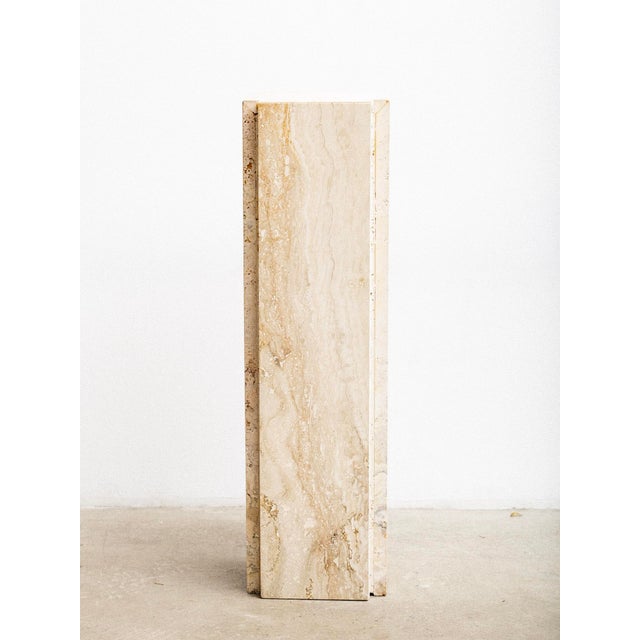 Post modern authentic travertine pedestal. Notched corners create a geometric silhouette. Natural veining and color...
