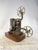 A classic and beautiful metal Super 8 home projector with an iconic vertical design and exposed reel arms. A piece of...