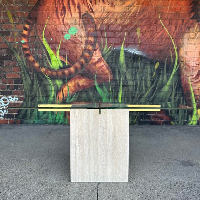 Post-modern console table by Artedi constructed out of marble, brass, and glass. Makers mark on back of marble. Base...