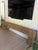 From Arhaus' Ubud Collection, this console is sustainably sourced reclaimed teak wood. It features oversized exposed...