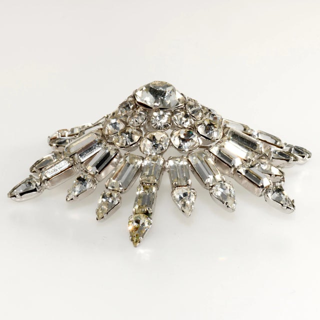 This is part of Chairish’s Costume Jewelry assortment. Glitzy starburst brooch embellished with clear rhinestones in...