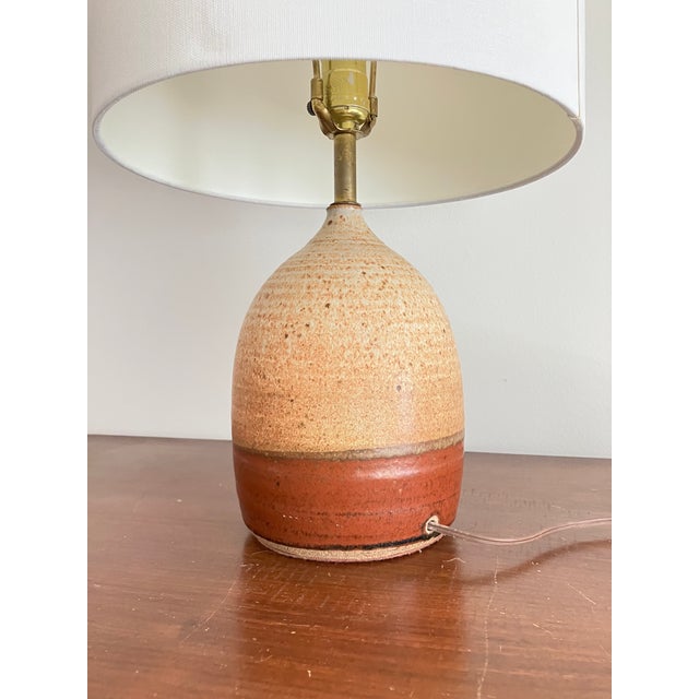 Gorgeous 1960s hand thrown stoneware lamp with neutral rust and brown tones. Bostlund style. Pinched tear drop style. Low...