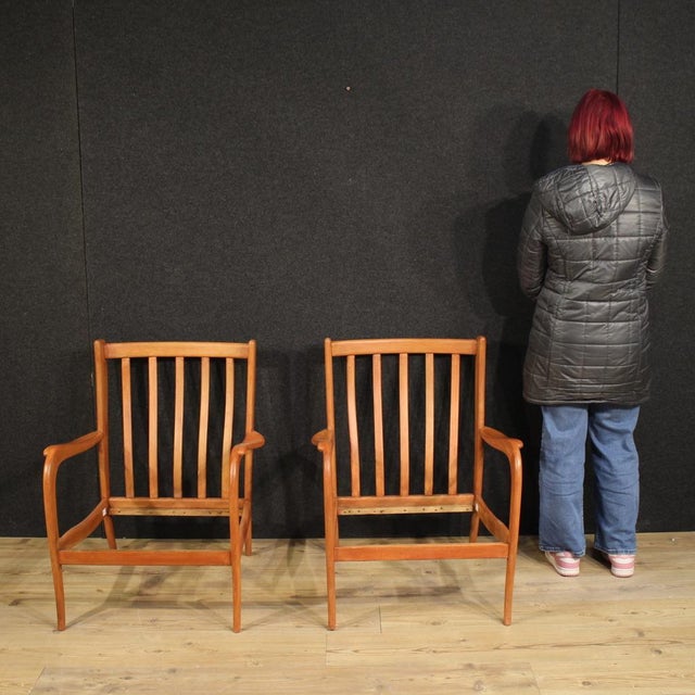 A pair of Italian armchairs from the 1970s. Carved cherry wood furniture in the style of Paolo Buffa, with beautiful lines...