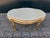 A refined vintage French Louis XVI style table dating from around 1950, beautifully crafted with a carved beechwood frame...