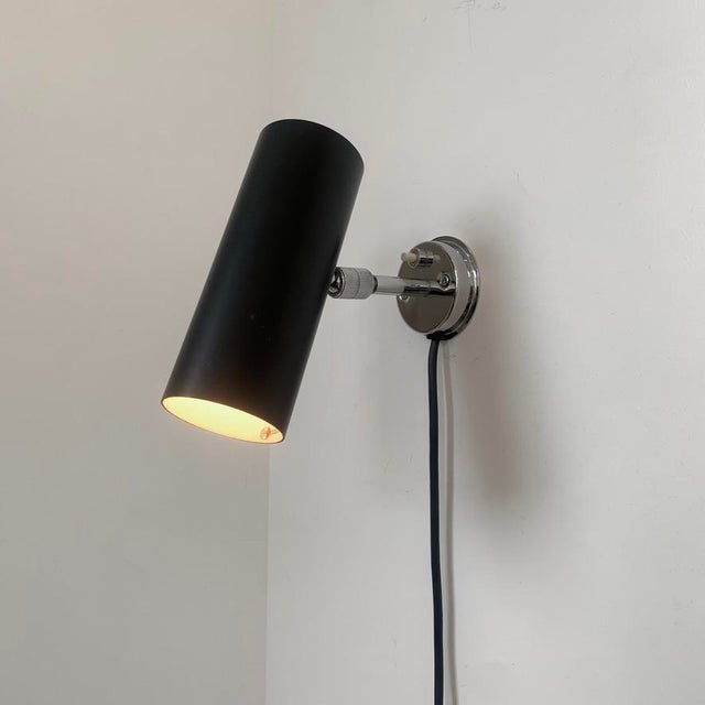 Gino sarfatti wall light, 31 b model for arteluce, circa 1950, italy. black and white laquered metal, rotating chromed...