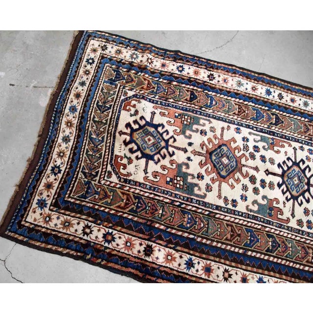 Handmade antique Caucasian Kazak rug in kele size. The rug is from the end of 19th century in original good condition....