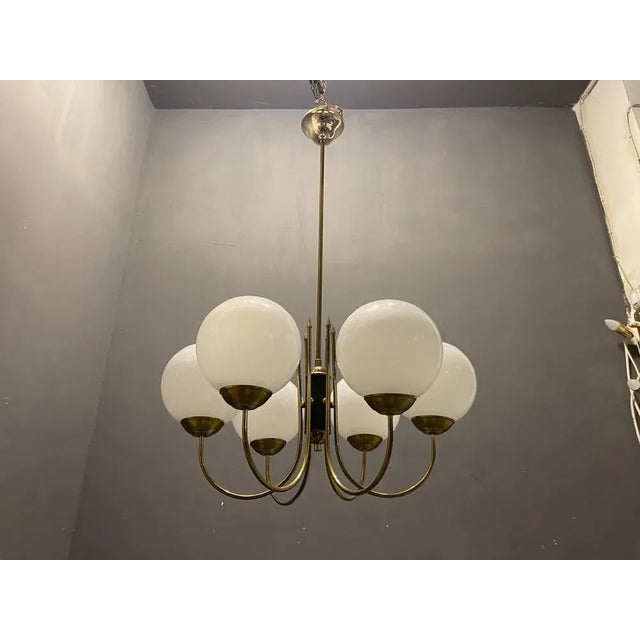 Opaline brass sputnik chandelier features 6 opaline glass globes brass frame with black and brass centerpiece height...
