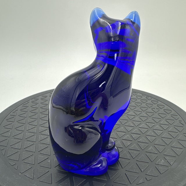 Add a touch of vintage elegance and feline charm to your collection with this **Vintage Mid-Century Modern Fenton Cobalt...